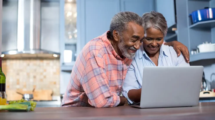 senior citizens looking at computer to find a senior citizen discount on natural gas in Georgia USA